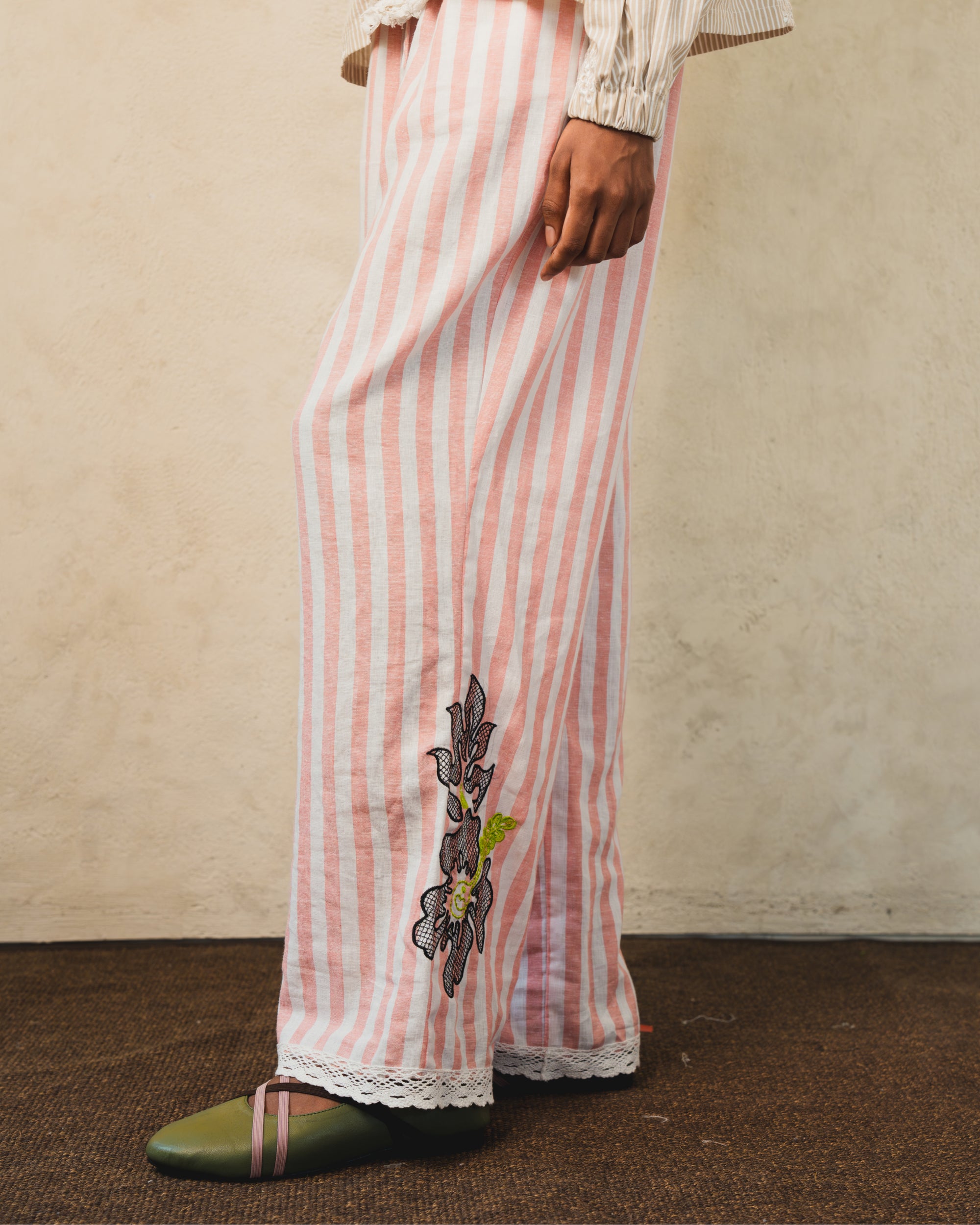 Image of Pino Embroidery Pants Stripes, wide-leg linen pants with adjustable drawstring waist.