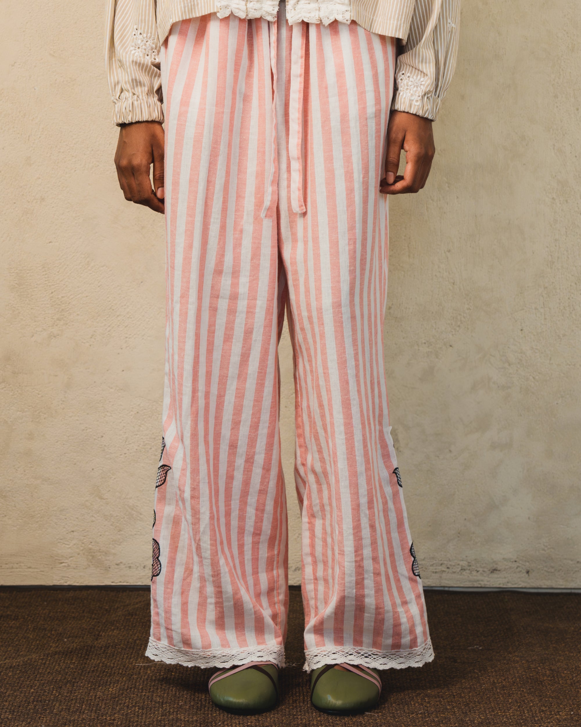 Image of Pino Embroidery Pants Stripes, wide-leg linen pants with adjustable drawstring waist.