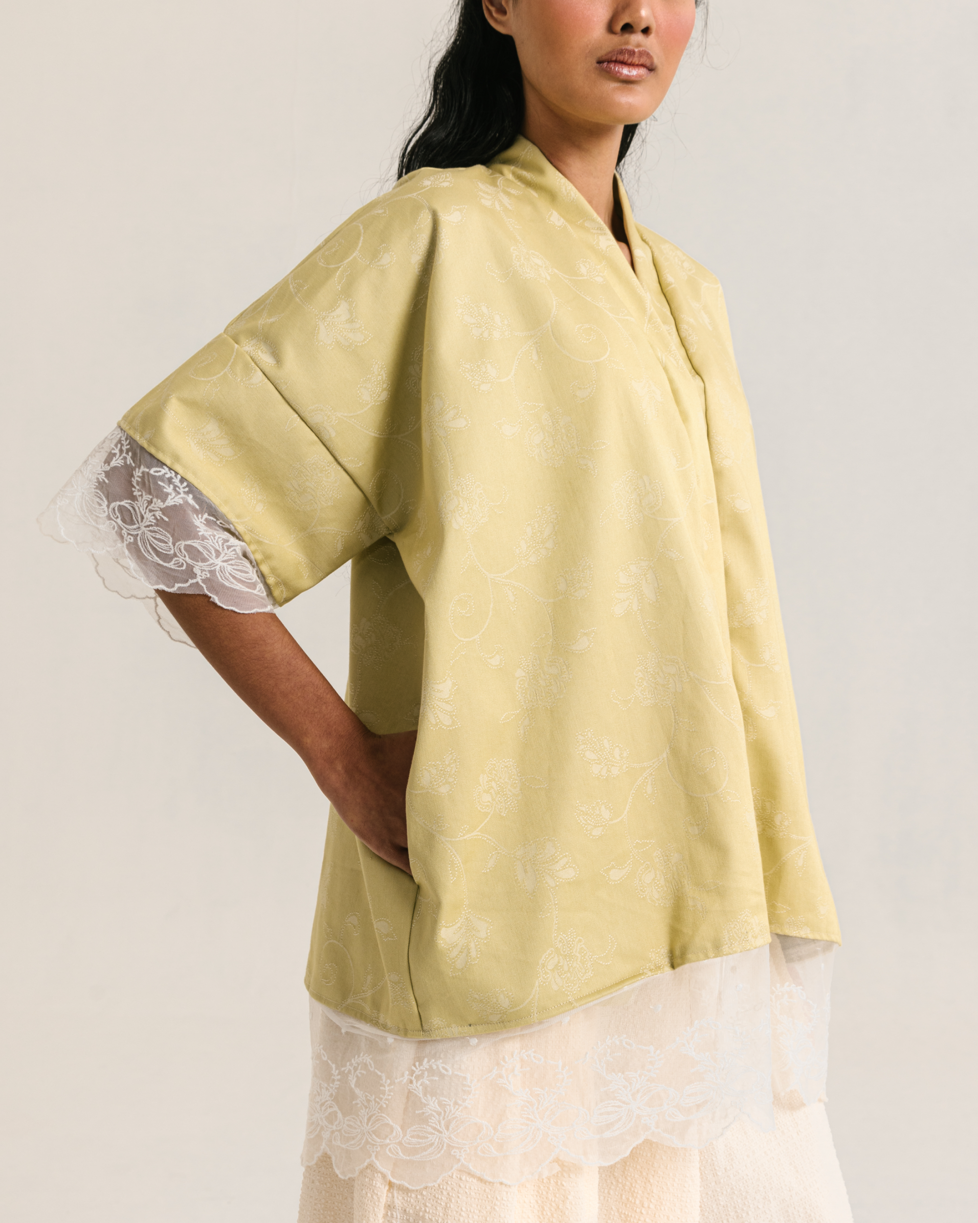 Image of Rayne Blouse Lime, a loose-fitting blouse made from cotton with a modest v-neckline.