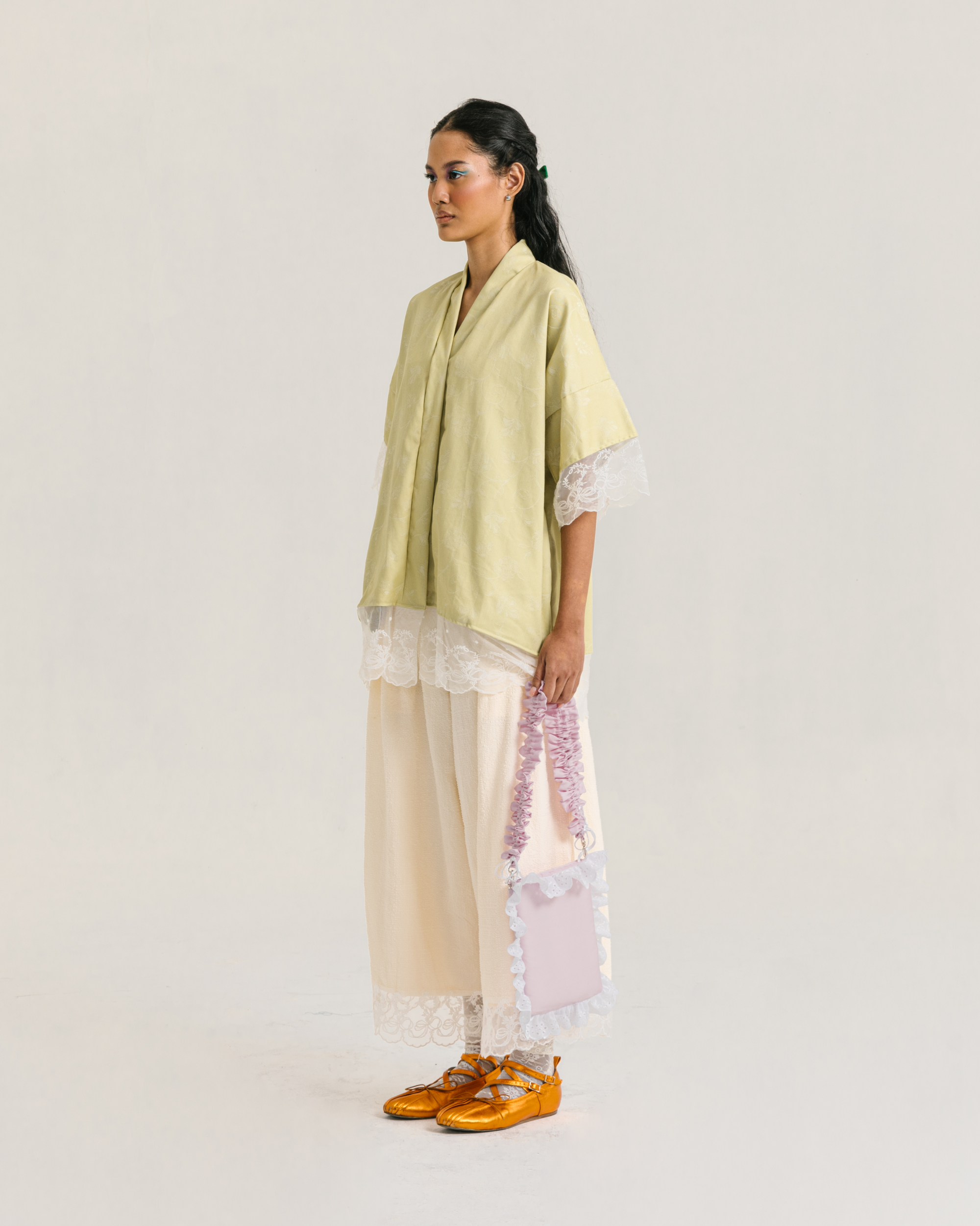 Image of Rayne Blouse Lime, a loose-fitting blouse made from cotton with a modest v-neckline.