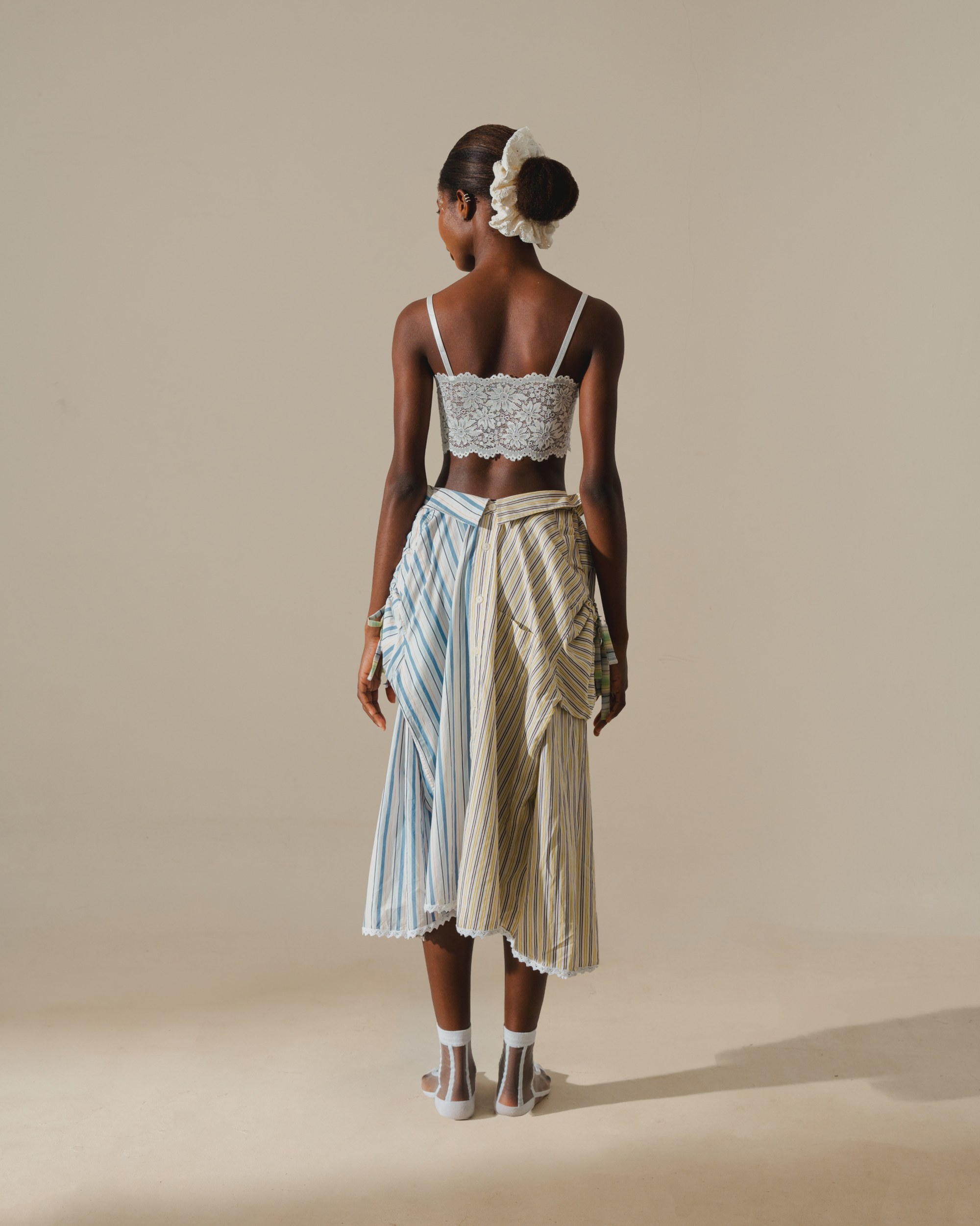 Image of RE-WORK SKIRT, a midi skirt made from two shirts combined together. 