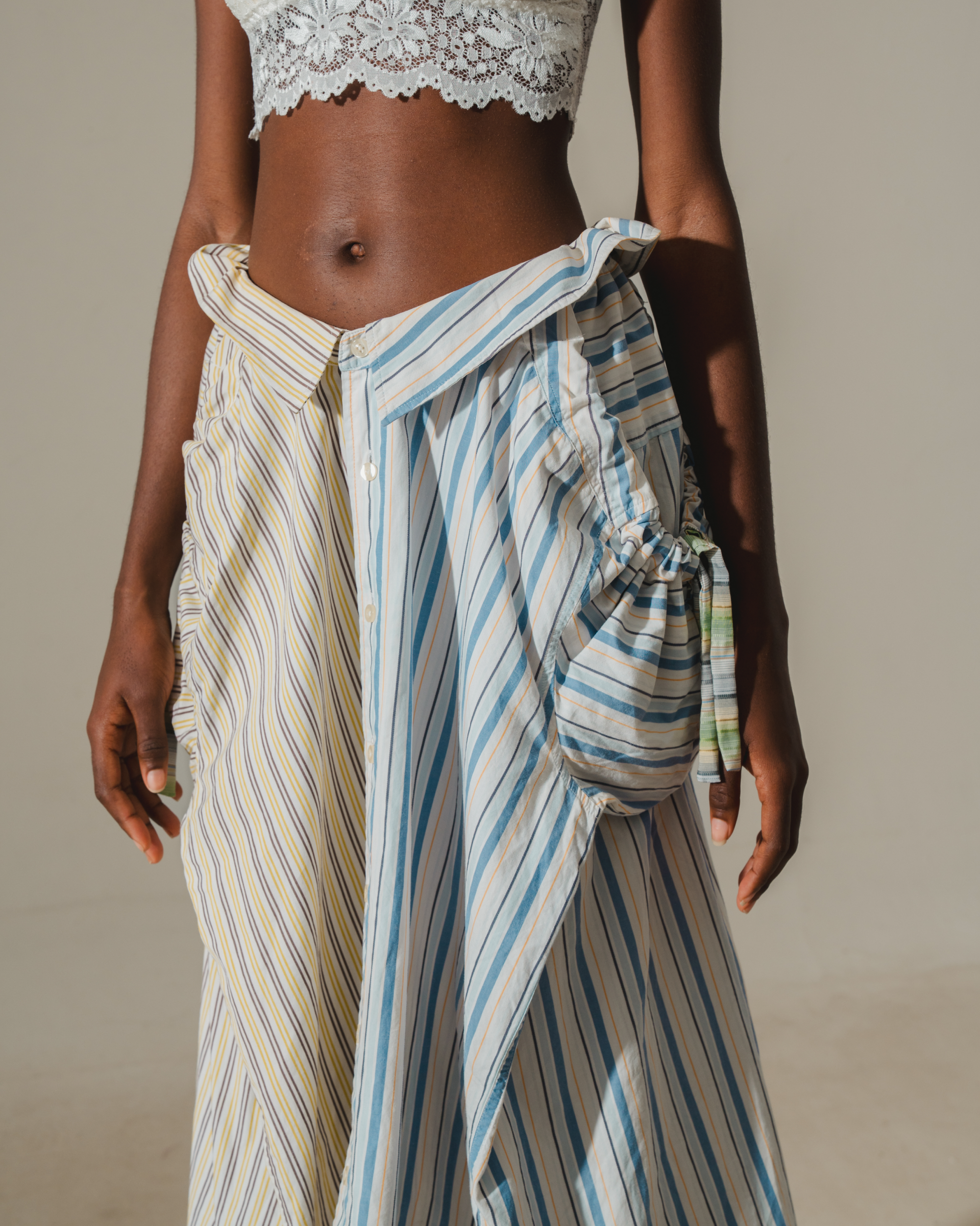 Image of RE-WORK SKIRT, a midi skirt made from two shirts combined together. 