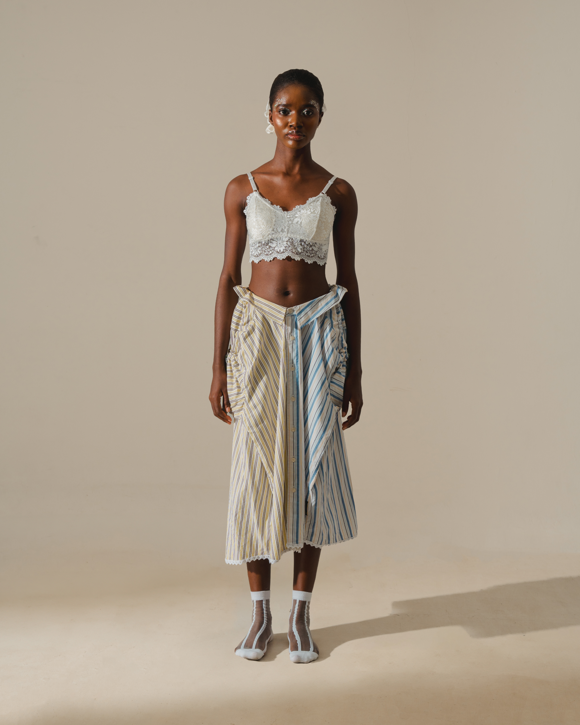 Image of RE-WORK SKIRT, a midi skirt made from two shirts combined together. 