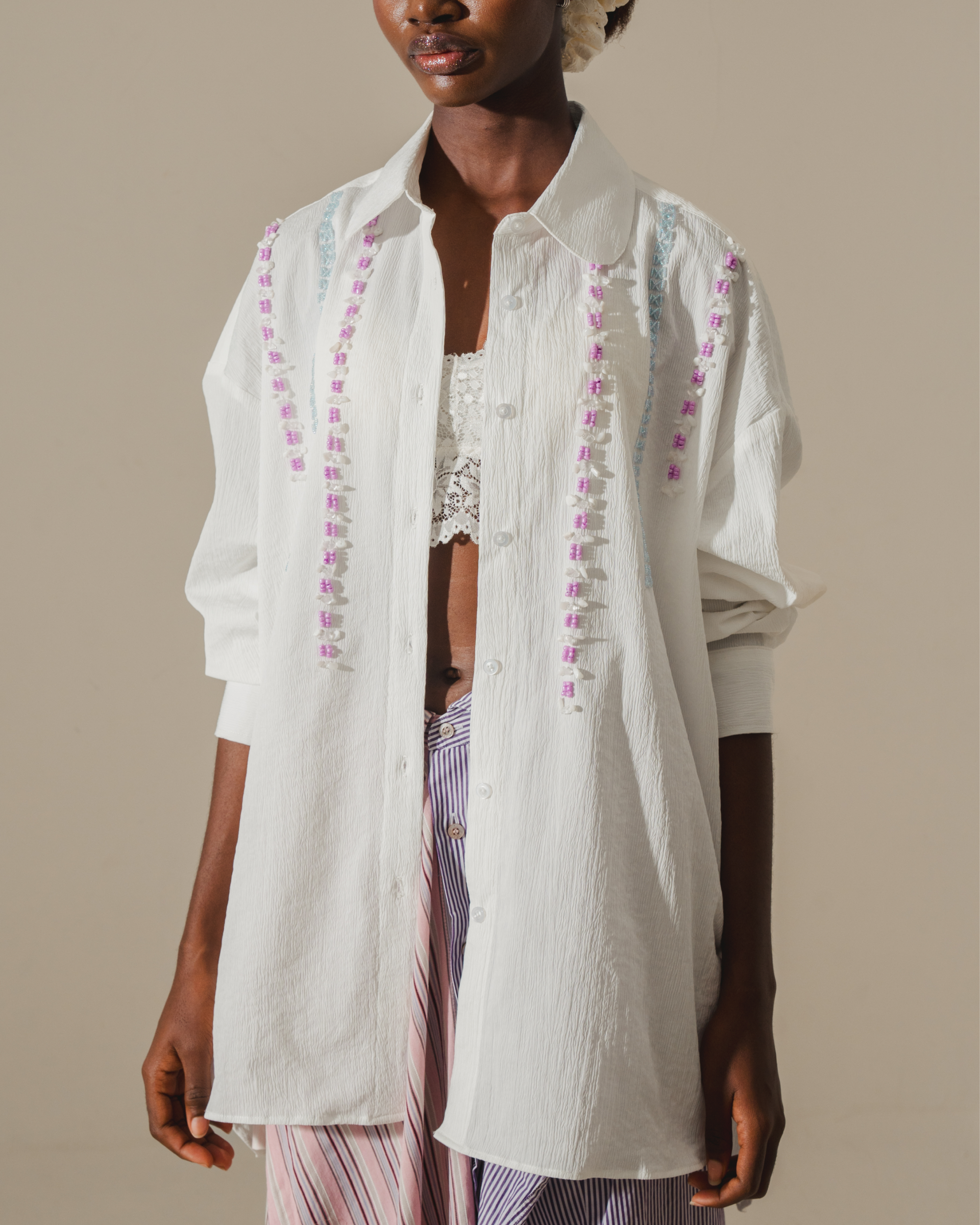 Image of Ringo Shirt White, a longsleeve shirt made from cotton, hand-embroidered with beads.