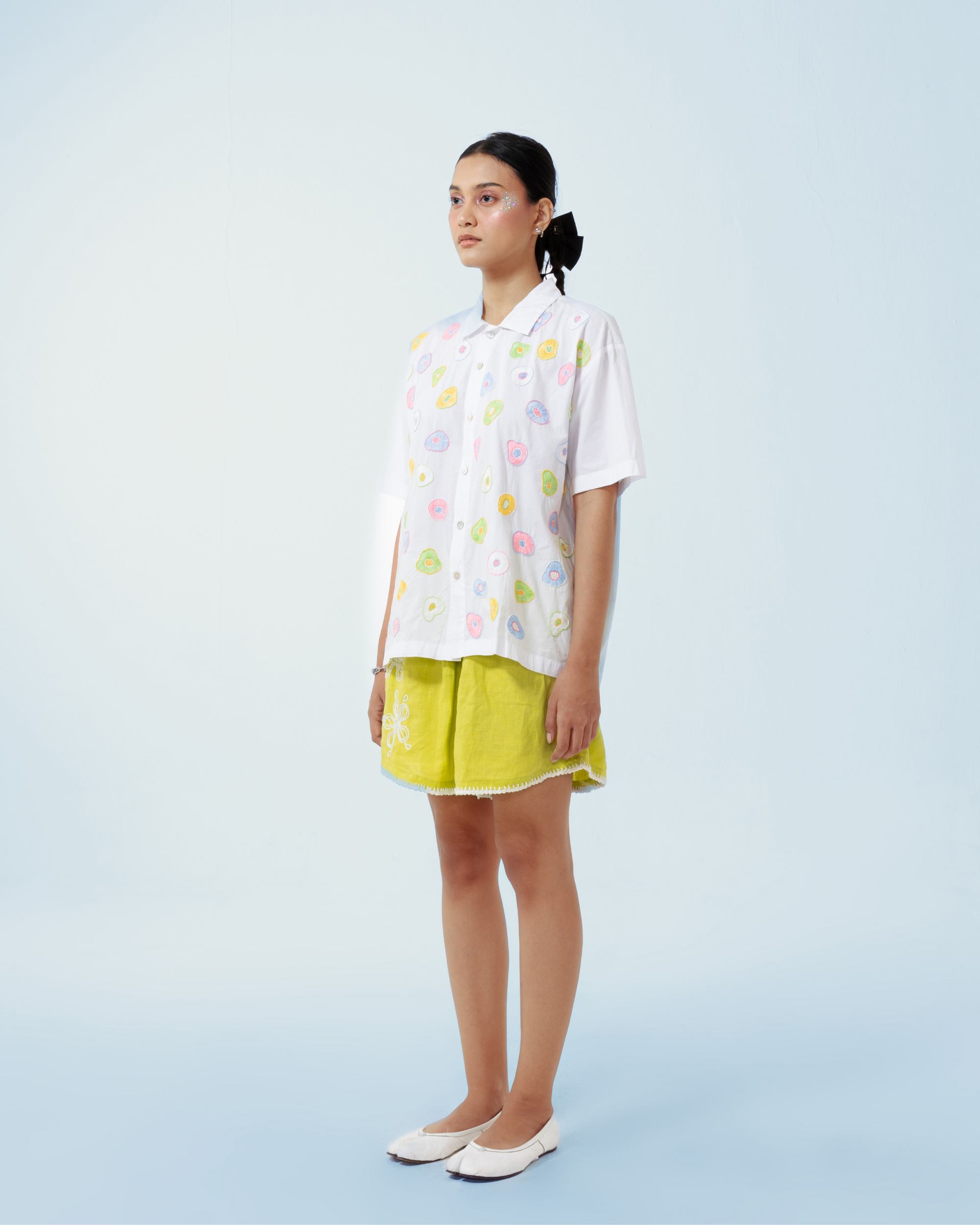 Image of Seta Embroidery Shirt Pastel, a basic white cotton shirt that is enhanced with artistic hand-embroidery details thoughout