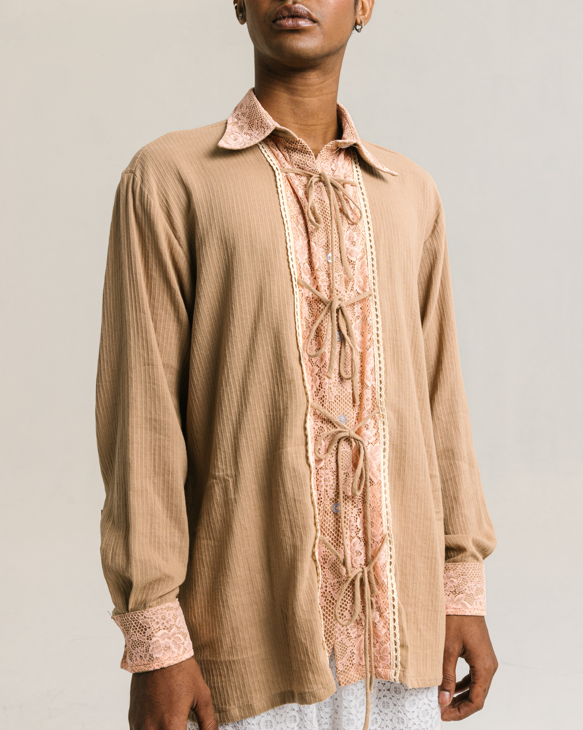 Image of Simone Longsleeve Shirt Brown, a longsleeve unisex shirt made from cotton-poly with an added lace and tie details on the front.