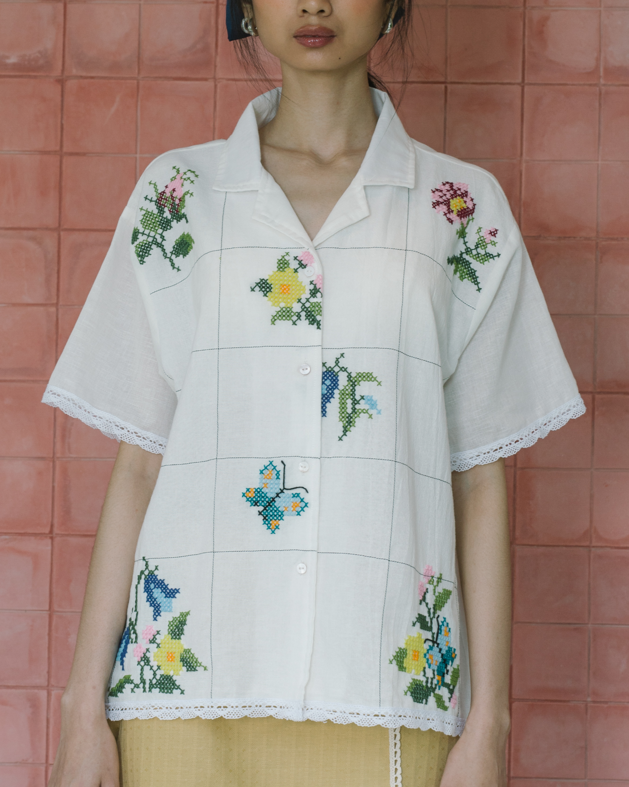 Image of Sophia Cross Sitches Shirt, a relaxed linen shirt adorned with intricate cross-stitches detail adds unique, artisanal touch of the design. 