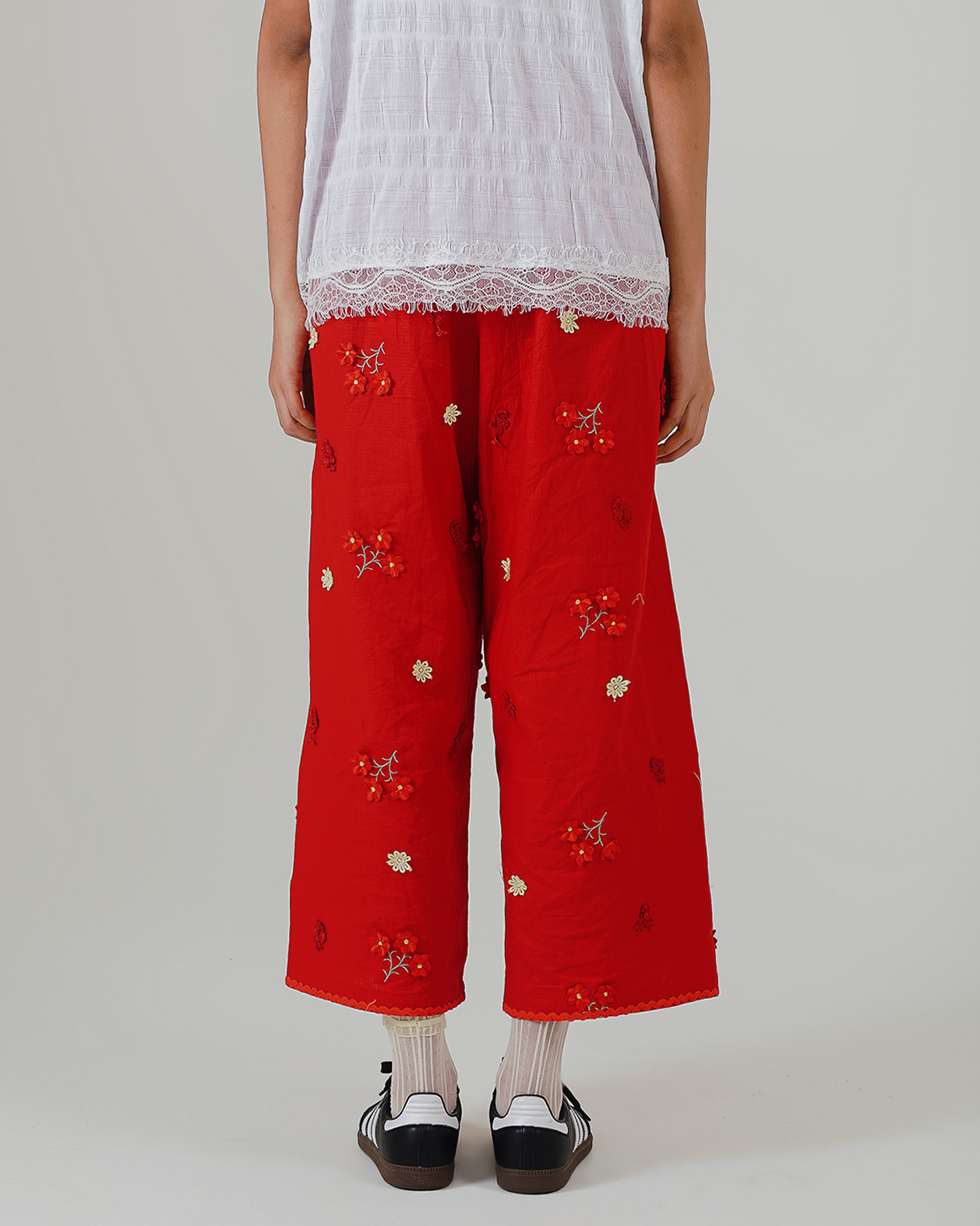 Image of Soraya Pants, a linen wide-leg relaxed pants adorned with floral embroidery.