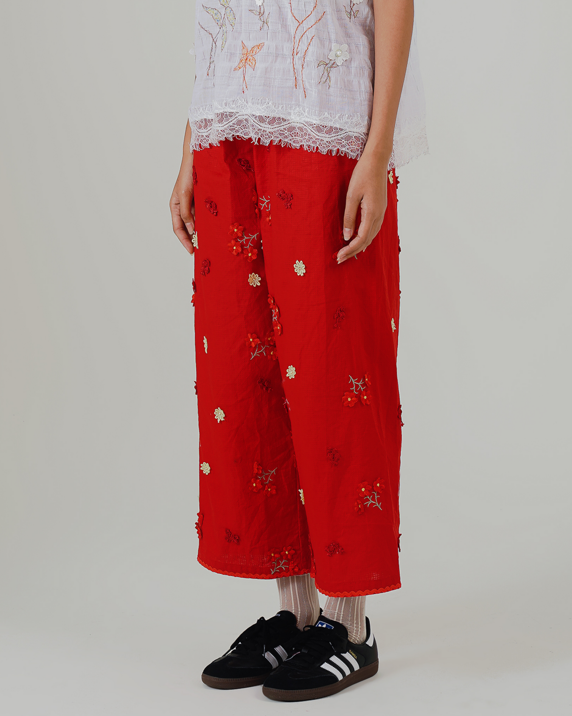 Image of Soraya Pants, a linen wide-leg relaxed pants adorned with floral embroidery.