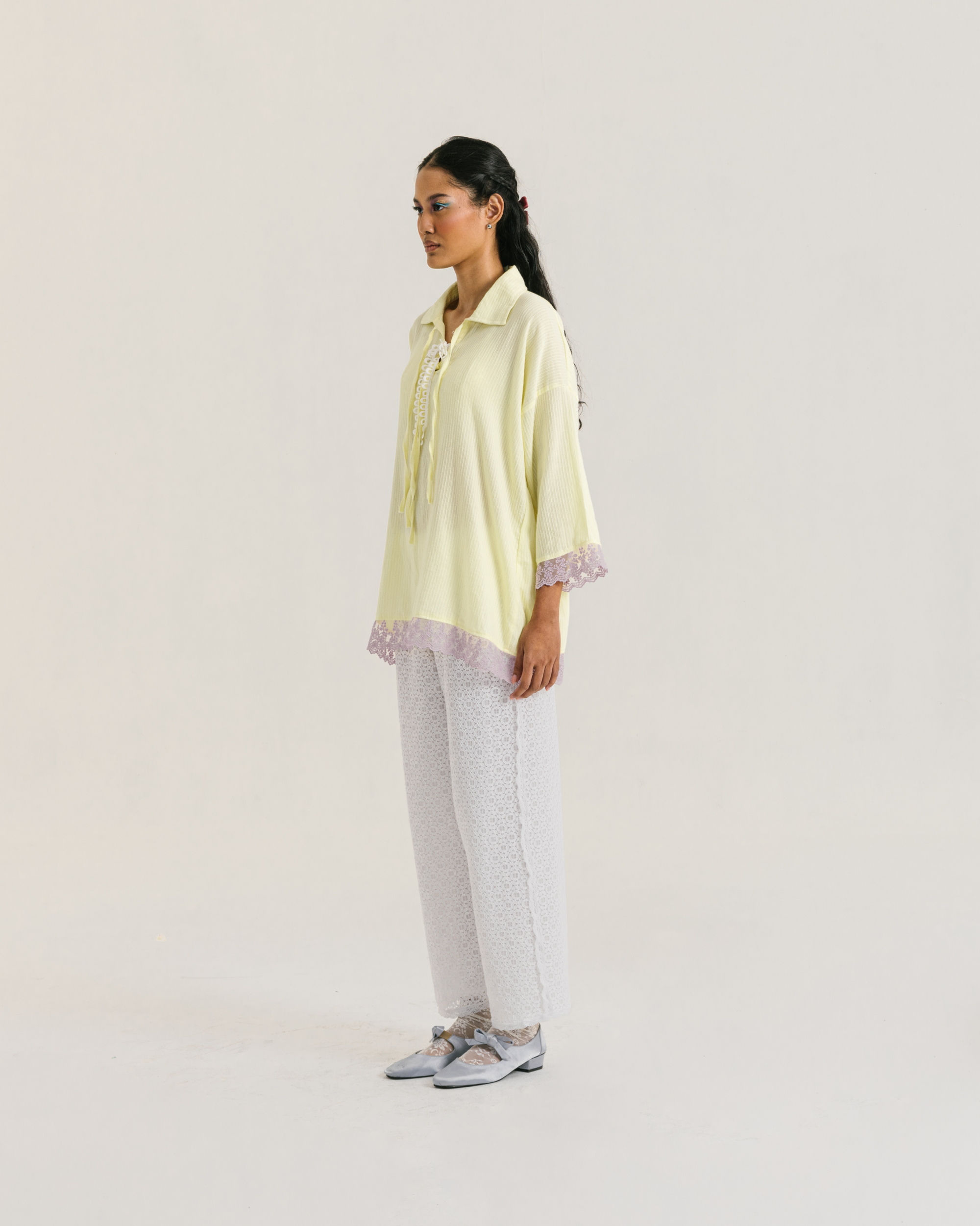 Image of Thea Longsleeve Yellow, a blouse made from cotton with ribbon-like lace on the front.