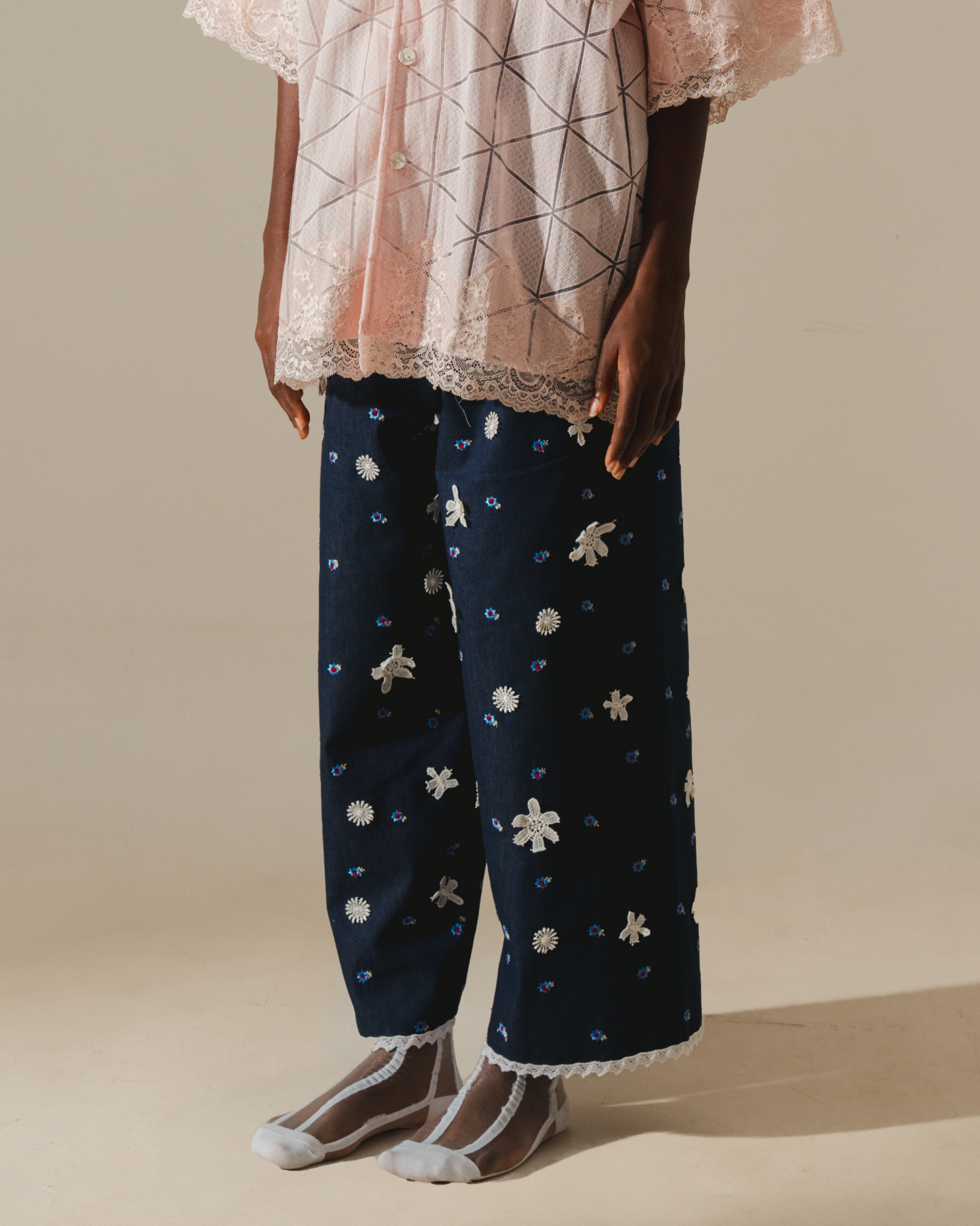 Image of Tiana Embroidery Pants, a relaxed wide-leg pants that are made from deadstock jacquard cotton, hand-embroidered with lace.