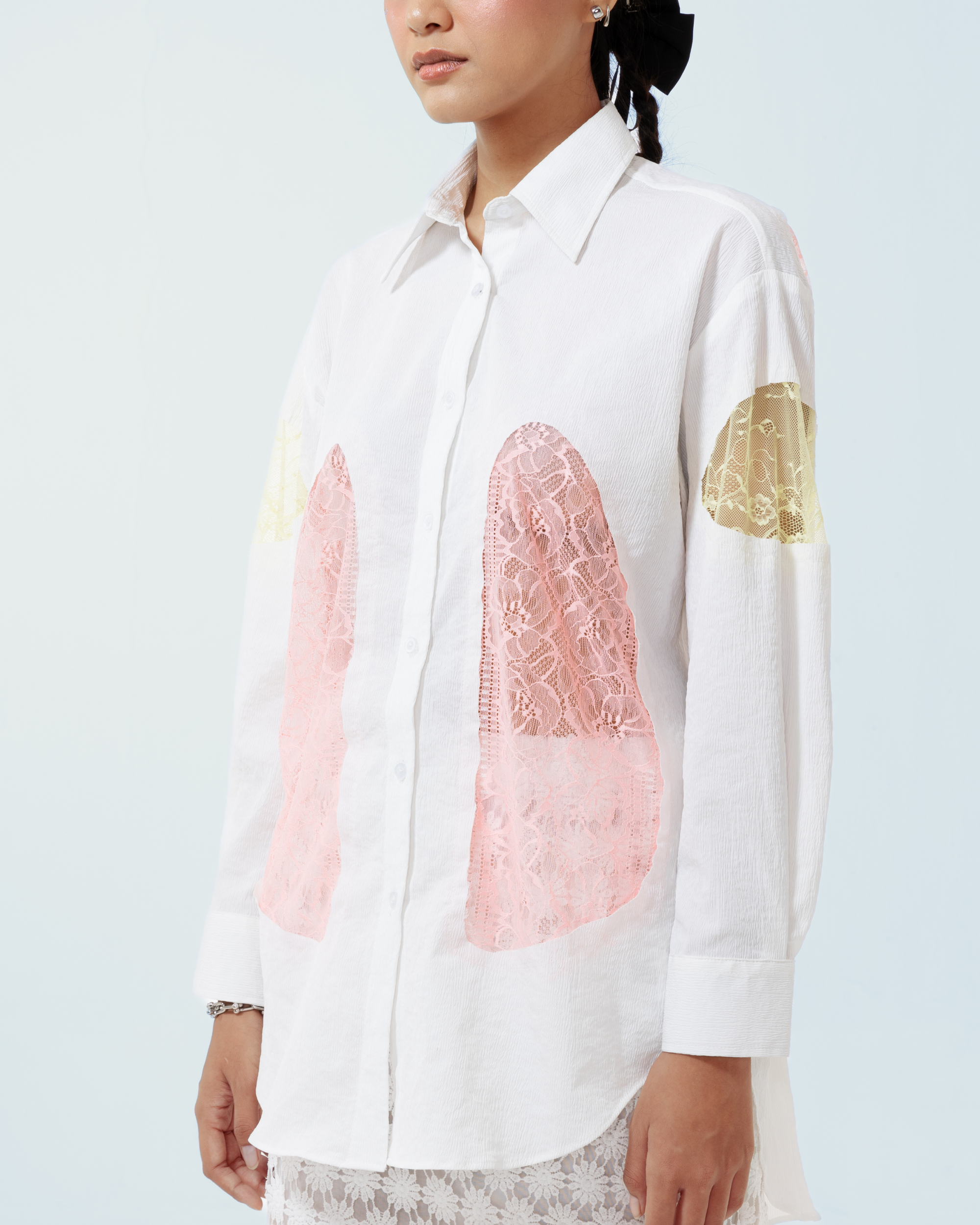 Image of Yoko Shirt White, a longsleeve shirt made from cotton crepe, features a contrast lace cut-out details along both sides and the sleeves.