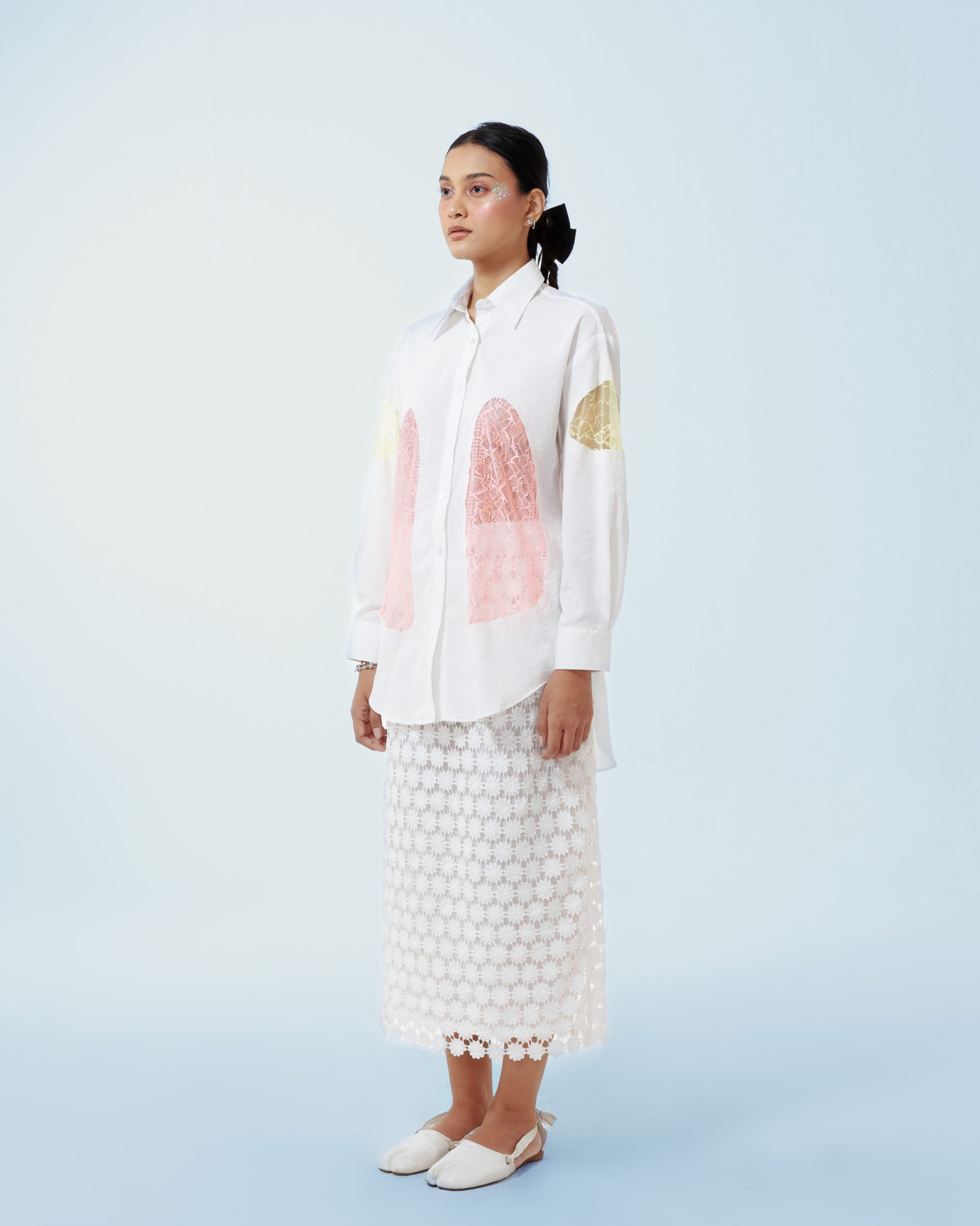 Image of Yoko Shirt White, a longsleeve shirt made from cotton crepe, features a contrast lace cut-out details along both sides and the sleeves.